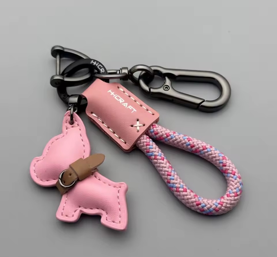 Pink braided rope keychain with leather charm
